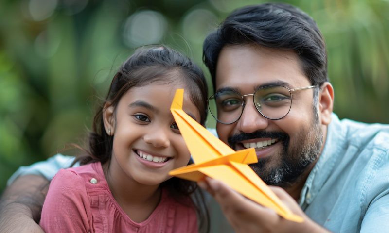 kid-playing-with-paper-plane